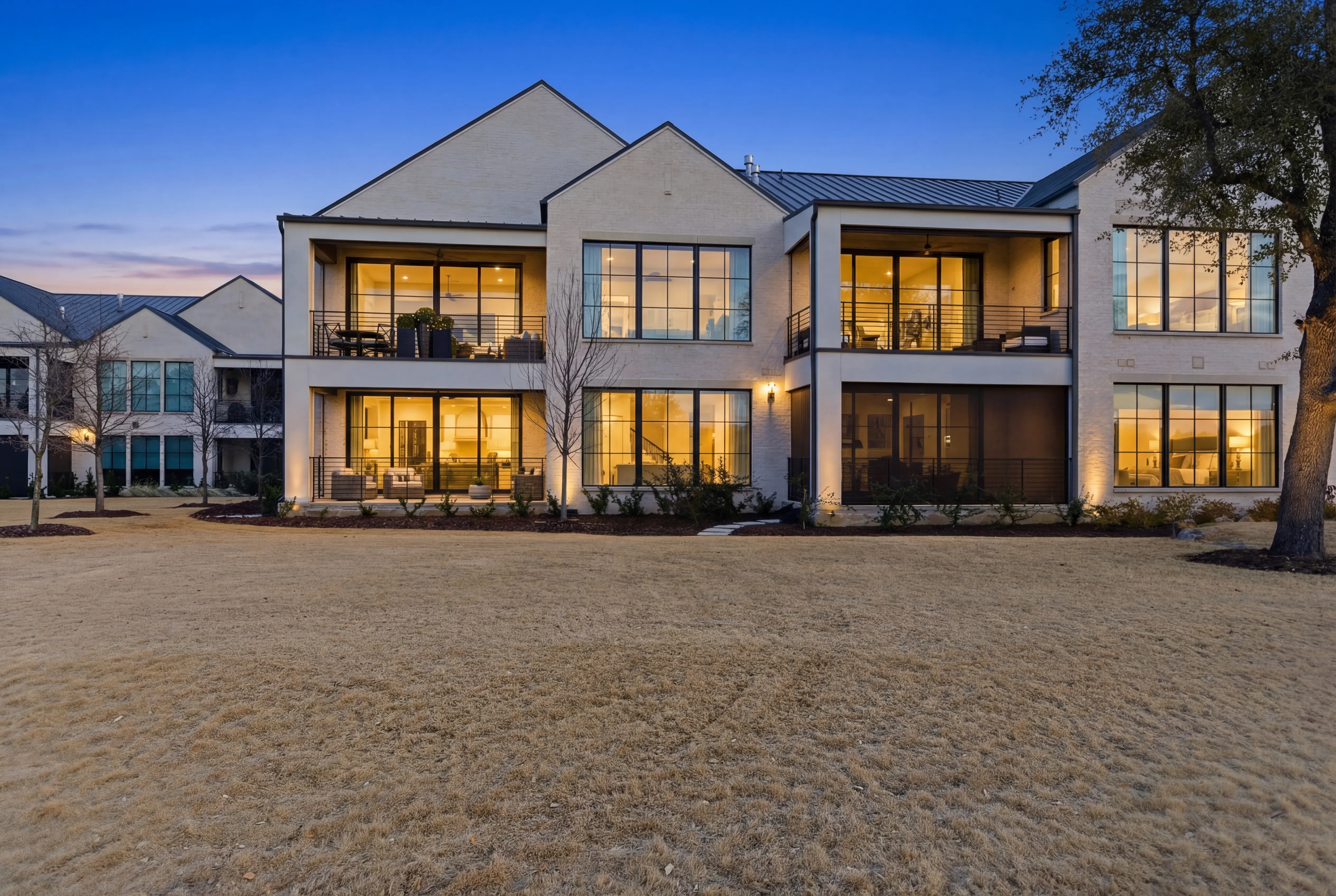 The Residences Villa 3 Unit 22 - Modern exterior at twilight from the fairway