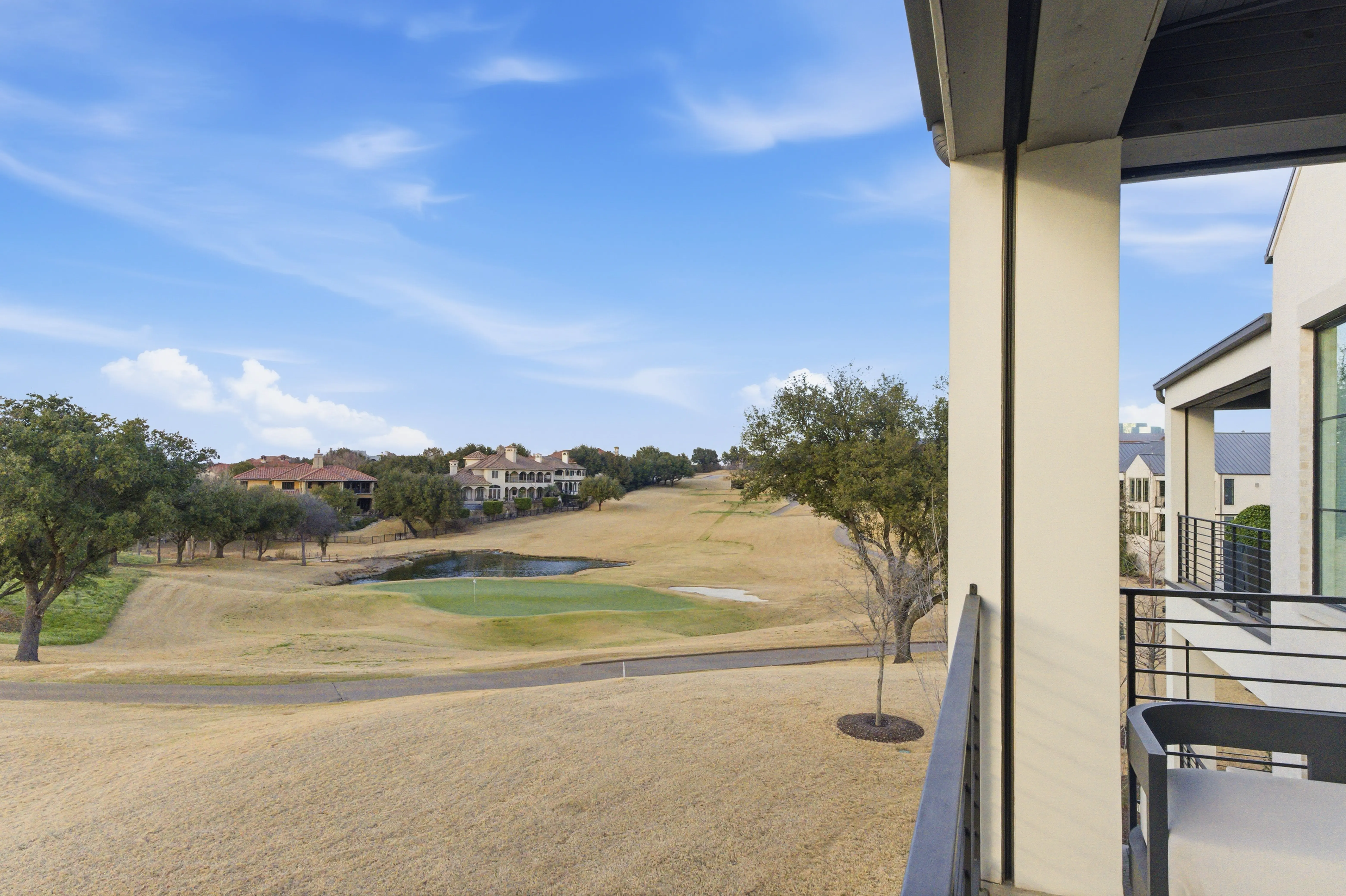 Panoramic fairway views with Nelson greens and neighboring estates